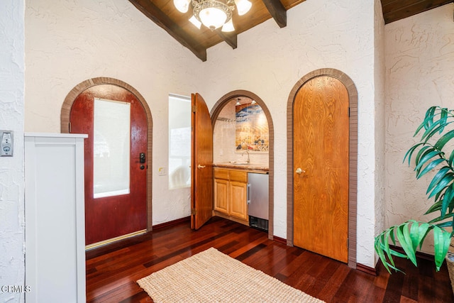5451 Reef Way, Oxnard, CA 93035 - entryway featuring a textured wall, dark wood-style flooring, wooden ceiling, and arched walkways