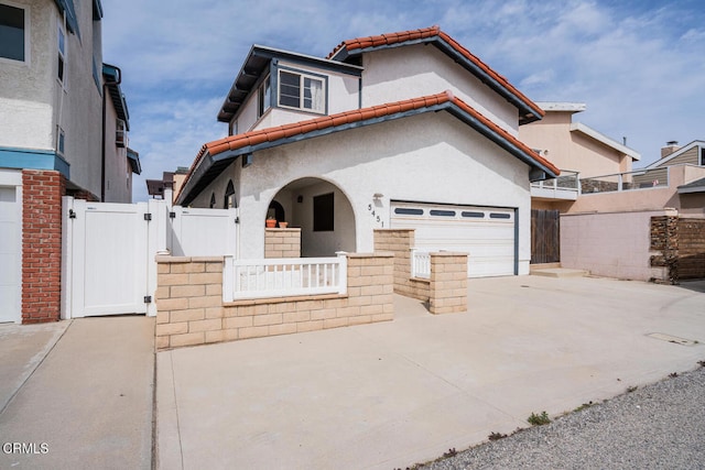 5451 Reef Way, Oxnard, CA 93035 - view of front of home featuring a gate, driveway, stucco siding, and a garage