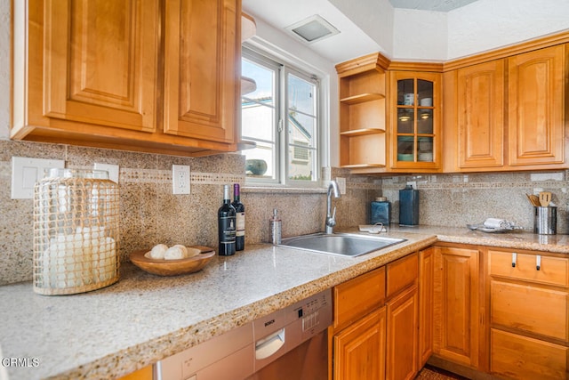 5451 Reef Way, Oxnard, CA 93035 - kitchen with stainless steel dishwasher, backsplash, glass insert cabinets, and brown cabinets