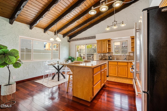 5451 Reef Way, Oxnard, CA 93035 - kitchen with freestanding refrigerator, wood ceiling, a textured wall, light countertops, and open shelves