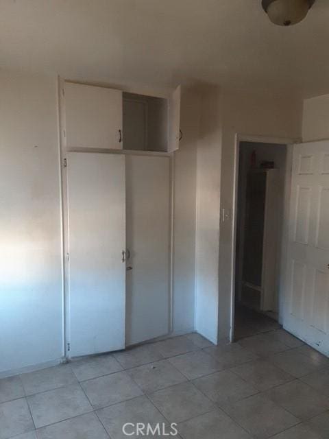 unfurnished bedroom featuring light tile patterned floors