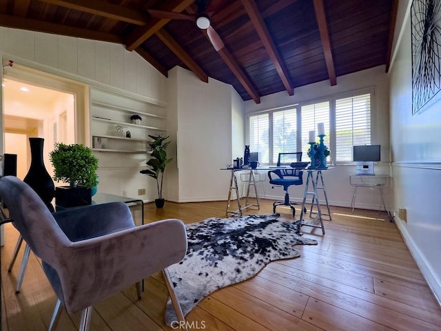 office area featuring hardwood / wood-style floors, built in shelves, baseboards, vaulted ceiling with beams, and wooden ceiling