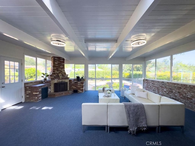 interior space featuring beam ceiling and a fireplace