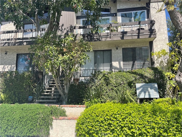 view of property featuring stairway