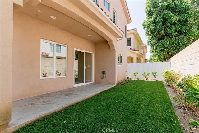 view of yard featuring a patio and a fenced backyard