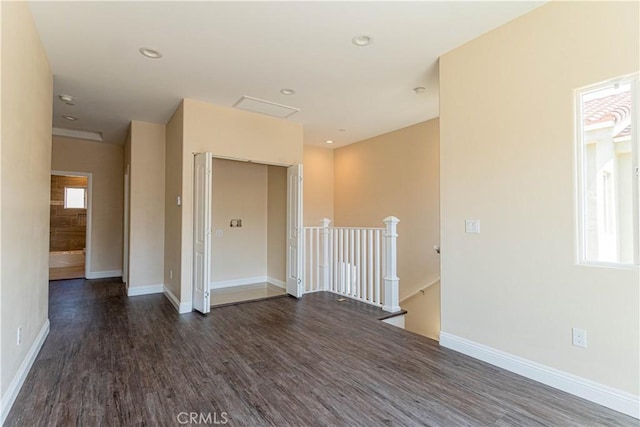 unfurnished room featuring recessed lighting, baseboards, and wood finished floors