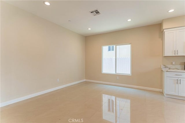 spare room featuring recessed lighting, visible vents, baseboards, and light tile patterned floors