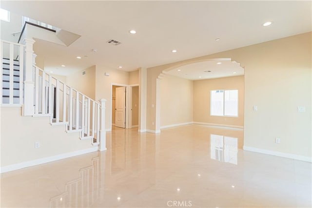 empty room featuring stairs, recessed lighting, visible vents, and baseboards