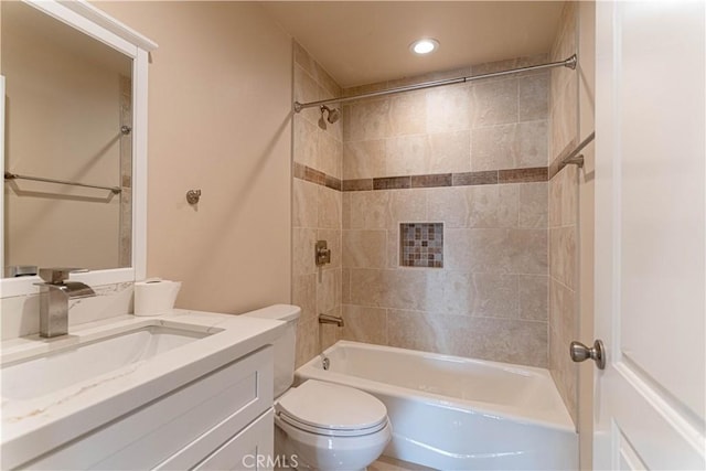 full bathroom with bathing tub / shower combination, toilet, and vanity