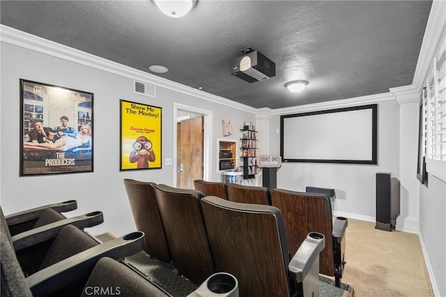 cinema with carpet, visible vents, crown molding, and baseboards