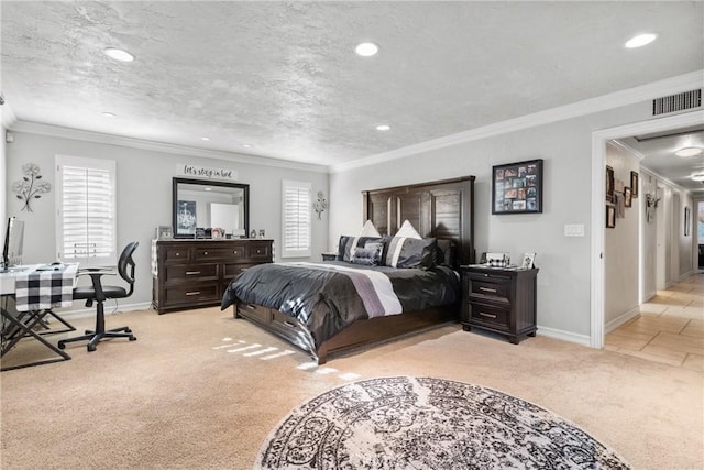 bedroom featuring baseboards, light colored carpet, visible vents, and a textured ceiling