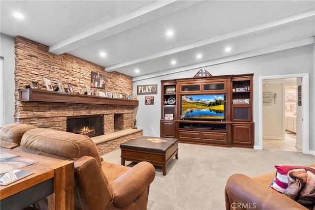 living area with a stone fireplace, vaulted ceiling with beams, light colored carpet, and recessed lighting