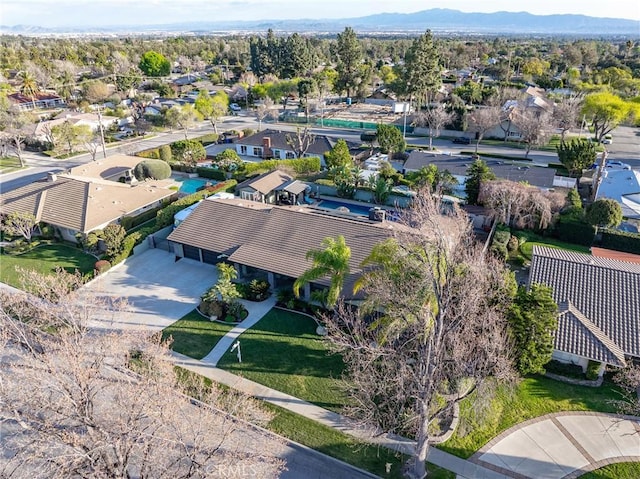 birds eye view of property featuring a mountain view and a residential view