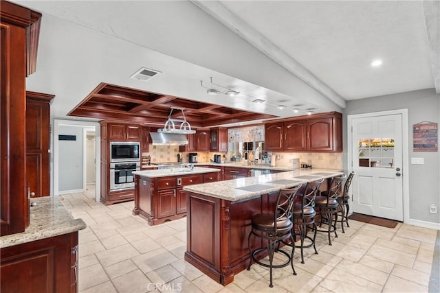 kitchen with ventilation hood, visible vents, coffered ceiling, built in microwave, and stainless steel oven