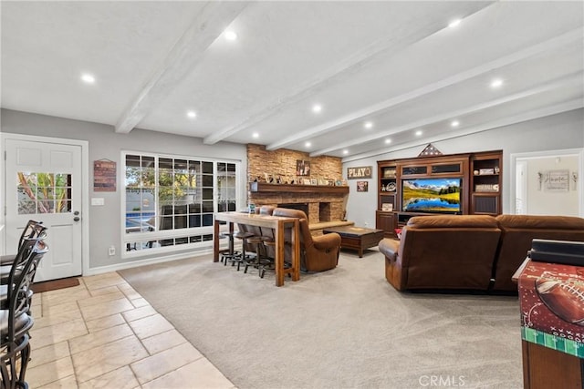 carpeted living room featuring stone tile floors, recessed lighting, a fireplace, and vaulted ceiling with beams