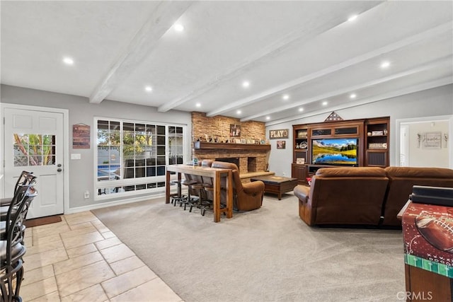 living room featuring stone tile flooring, beam ceiling, baseboards, recessed lighting, and a stone fireplace