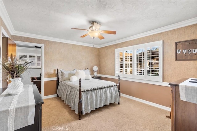 bedroom with light colored carpet, crown molding, baseboards, and ceiling fan