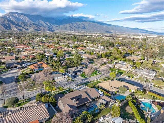 birds eye view of property with a residential view and a mountain view