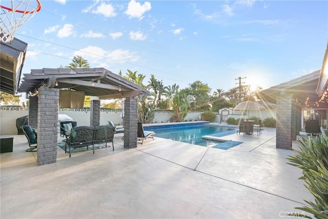 view of swimming pool featuring a patio area, a fenced in pool, a fenced backyard, and an outdoor hangout area