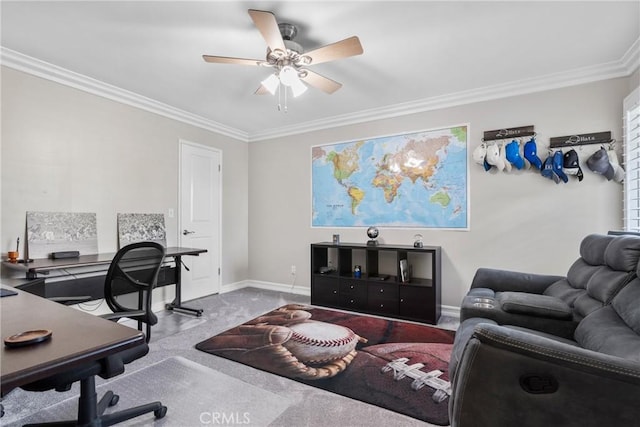 carpeted home office featuring baseboards, ceiling fan, and crown molding