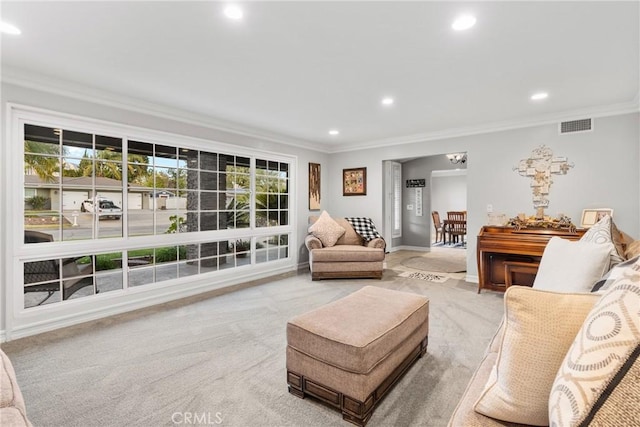 carpeted living room featuring crown molding, recessed lighting, visible vents, and a wealth of natural light