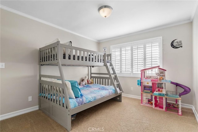 bedroom with crown molding, carpet, and baseboards