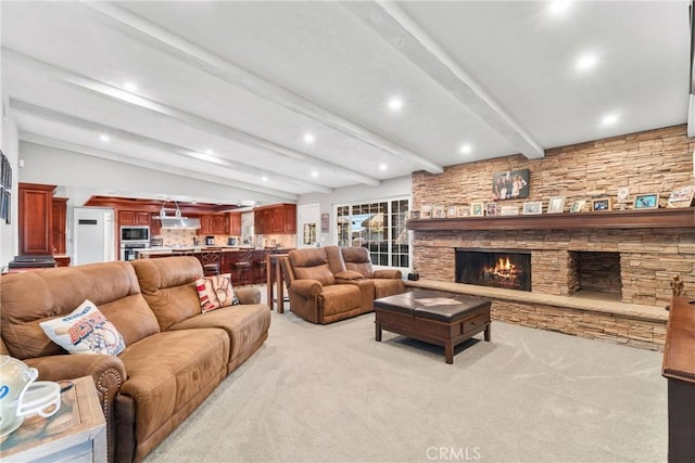 living area featuring light carpet, recessed lighting, a fireplace, and lofted ceiling with beams