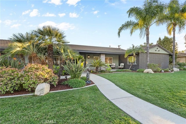 ranch-style home with a front lawn