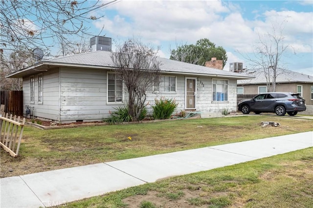 ranch-style house featuring central air condition unit, fence, a front yard, crawl space, and a chimney