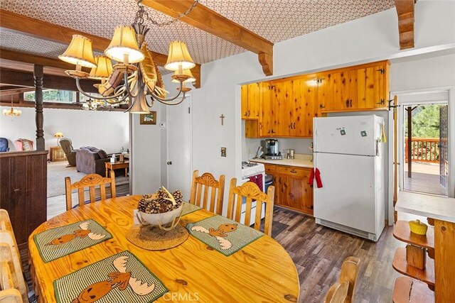 dining space featuring beam ceiling, a notable chandelier, and dark wood-style floors