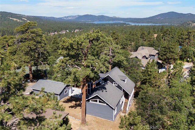 bird's eye view featuring a mountain view and a view of trees