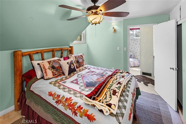 carpeted bedroom featuring visible vents and a ceiling fan