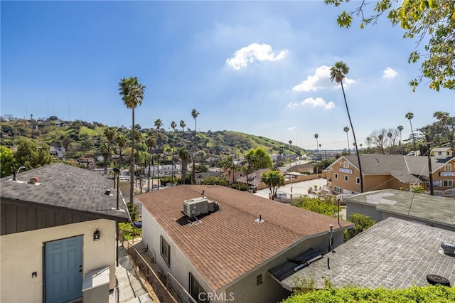 drone / aerial view featuring a residential view and a mountain view