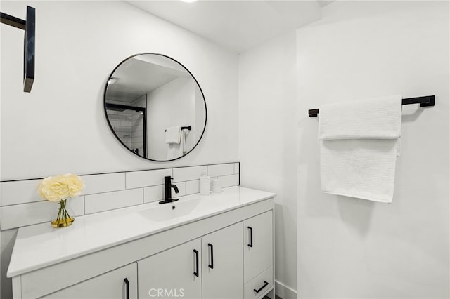 bathroom with decorative backsplash and vanity