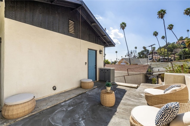 view of patio featuring fence