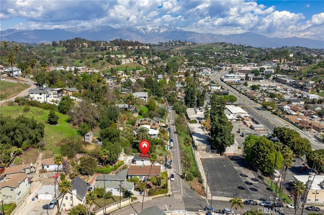 birds eye view of property with a mountain view and a residential view