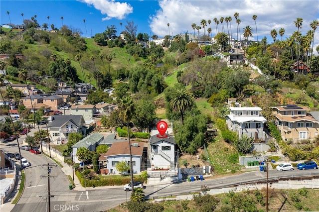 birds eye view of property with a residential view