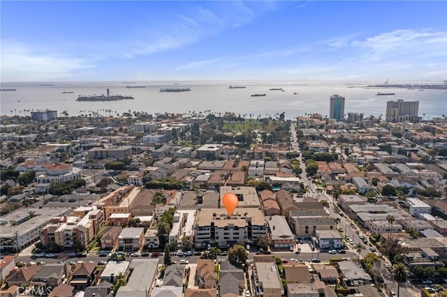 drone / aerial view with a city view and a water view