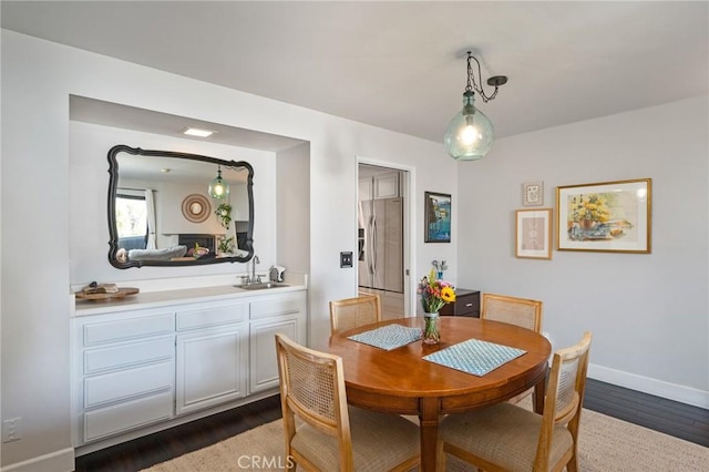 2032 E Bermuda St Unit 102, Long Beach, CA 90814 - dining area featuring dark wood finished floors and baseboards