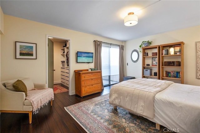 2032 E Bermuda St Unit 102, Long Beach, CA 90814 - bedroom with a spacious closet, dark wood-style flooring, access to outside, and a closet