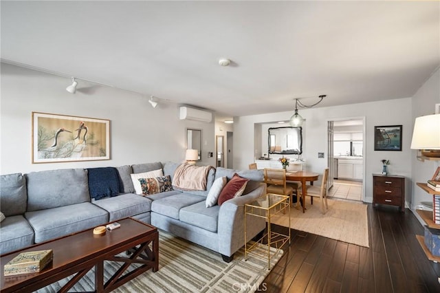 2032 E Bermuda St Unit 102, Long Beach, CA 90814 - living area featuring a wall mounted AC, dark wood finished floors, and rail lighting