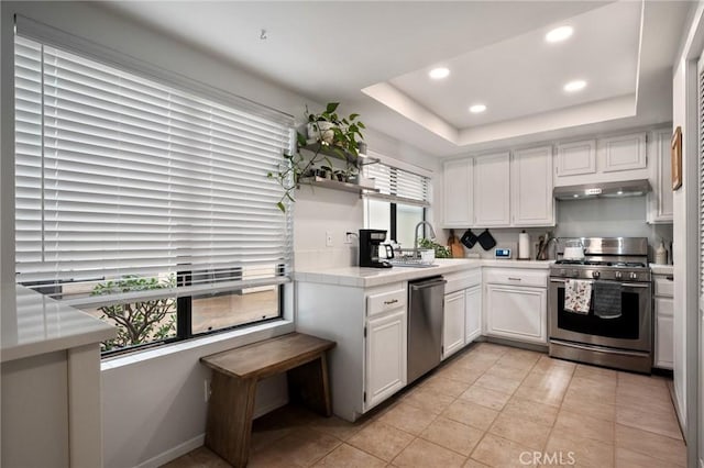 2032 E Bermuda St Unit 102, Long Beach, CA 90814 - kitchen featuring appliances with stainless steel finishes, open shelves, recessed lighting, tile counters, and white cabinetry
