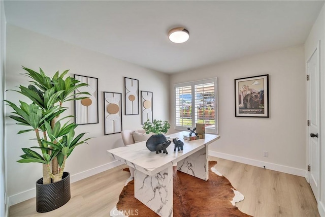 home office featuring light wood-style floors and baseboards