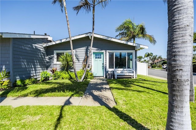 view of front of house featuring a front yard and fence