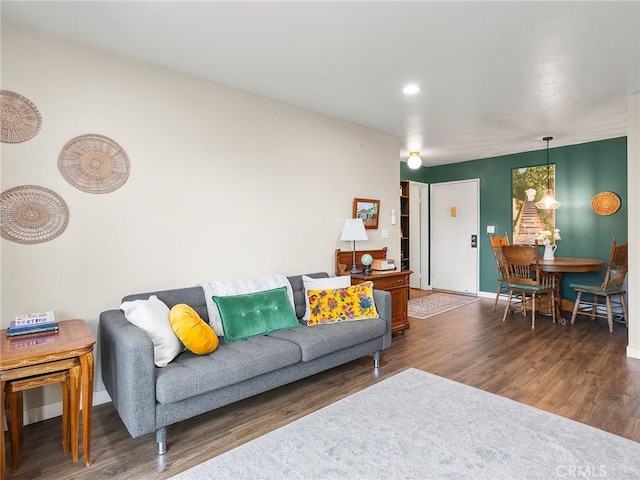 living area featuring wood finished floors and baseboards