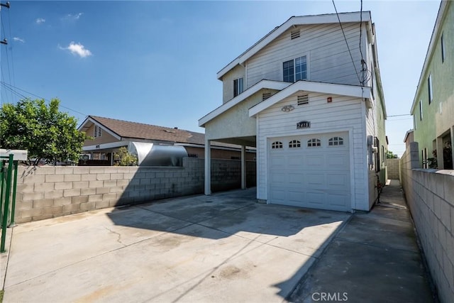 traditional home with driveway and fence