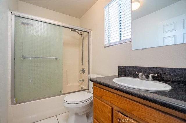 full bath with enclosed tub / shower combo, tile patterned flooring, toilet, and vanity