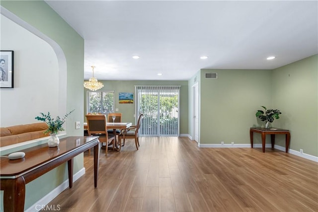 interior space with recessed lighting, wood finished floors, visible vents, and baseboards