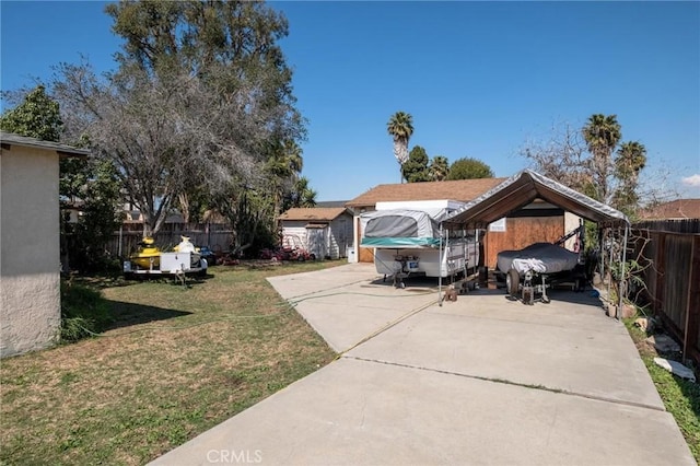 exterior space with a fenced backyard and a front lawn