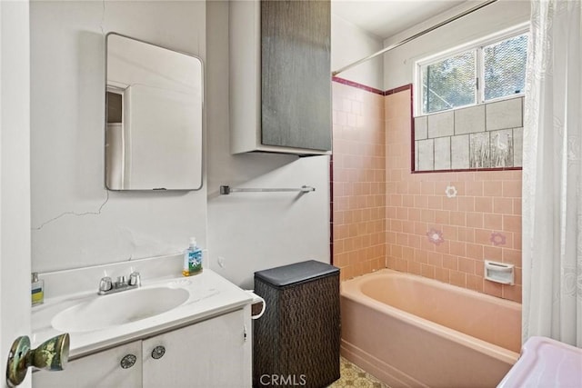 full bath featuring vanity and shower / bath combo